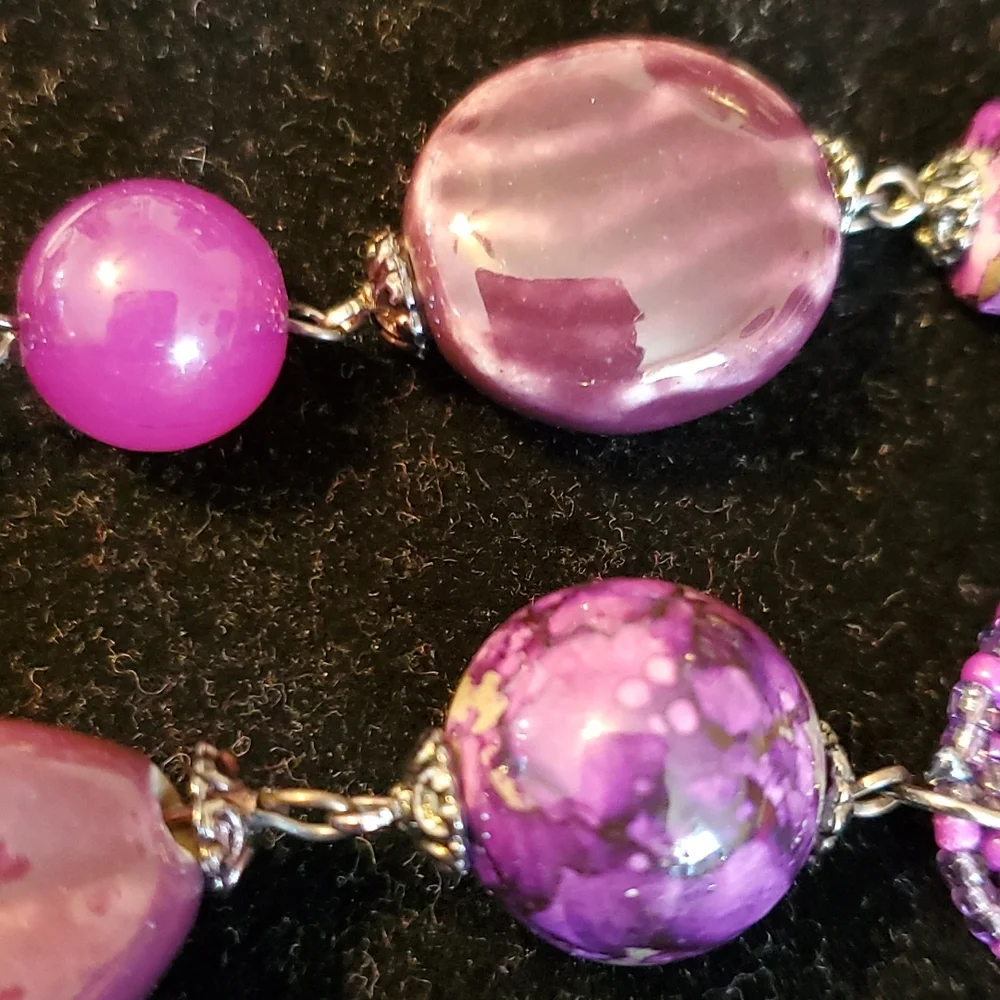Gunmetal double strand necklace with purple seed bead bows and marble look beads